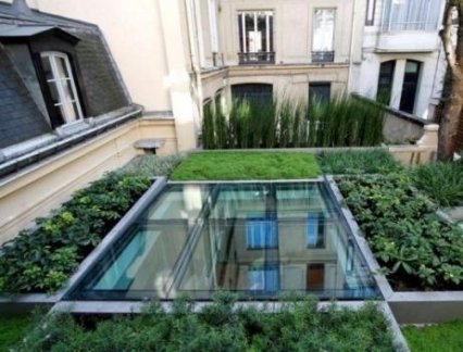 Double vitrage décalé pour une terrasse-puits de lumière