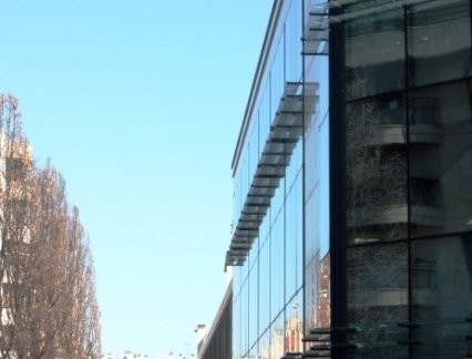Solar control for a structural sealed glass facade