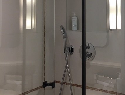 Anti-corrosion toughened glass for a shower stall